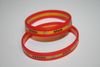 2 SPAIN ESPAND RED AND YELLOW LAYERED SILICONE BRACELETS WRISTBANDS ..NEW