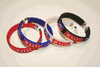 4 HAITI COUNTRY FLAG FLEXIBLE METAL NYLON BRACELETS ... ( 1 BLACK, 1 RED, 1 WHITE & 1 BLUE )