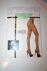 LIGHT GREEN SEAMLESS FISHNET PANTYHOSE BY MUSIC LEGS ... 100-175 LBS .. NEW IN PACKAGE