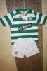 THE CELTIC FOOTBALL CLUB GREEN AND WHITE SOCCER JERSEY WITH WHITE SHORTS .. NEW