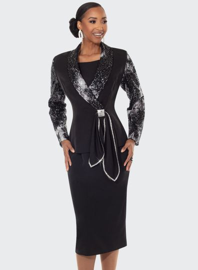 Donna Vinci Couture <br> (Fall 2025) <br> DV12213 <br> <br> BLACK/SILVER <br> 8 10 12 14 16 18 20<br> <br> 2pc. Jacket & Skirt Set <br> Novelty Sequin Fabric in Black & Silver, Designed With Crepe Fabrics For Jacket & Skirt.  Rhinestone Trimmed Front Closure Bow