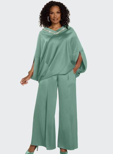 Donna Vinci Couture <br> (Spring/Summer 2026) <br> DV12244-SG <br> <br> SAGE-GREEN <br> 8 10 12 14 16 18 20<br> <br> 2pc. Top & Pant Set <br> High Quality Satin Crepe Fabric, All Around Neck Trimmed With Beautiful Rhinestones