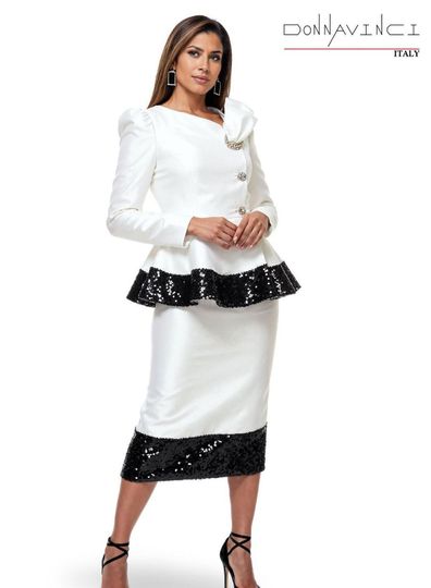 Donna Vinci Couture <br> (Spring/Summer 2026) <br> DV12252-WH <br> <br> WHITE/BLK <br> 8 10 12 14 16 18 20<br> <br> 2pc. Jacket & Skirt Set <br> Virtual Silk Look Fabric, Trimmed With Black Sequin Novelty Fabric & Updated Buttons