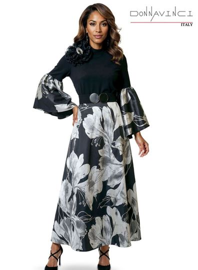 Donna Vinci Couture <br> (Spring/Summer 2026) <br> DV12257 <br> <br> BLACK/SILVER <br> 8 10 12 14 16 18 20 22<br> <br> Dress <br> Black Crepe Fabric With Stretch Designed With a Beautiful Novelty Fabric. Trimmed With Rhinestone Broach.  Belt Included