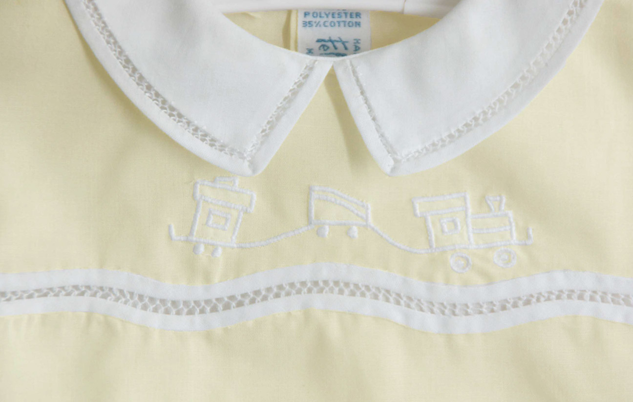 Feltman Brothers pale yellow romper with embroidered trains,Feltman