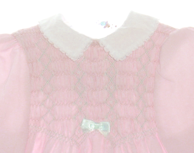 Polly Flinders pink smocked baby dress with white collar and white bow