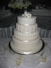 Four tier-stacked ivory wedding cake - by My Pink Apron