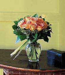 12 Yellow  roses with bear grass in a charming glass vase