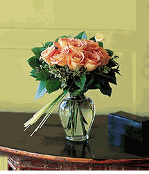 12 Yellow  roses with bear grass in a charming glass vase