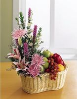 A basket of flowers and fruit