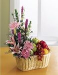 A basket of flowers and fruit