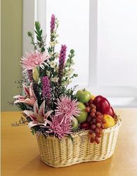 A basket of flowers and fruit