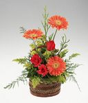 A handled basket of mixed flowers birthday