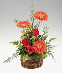 A handled basket of mixed flowers birthday