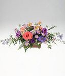 A table centerpiece of colorful flowers