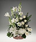 Basket arrangement of mixed white flowers
