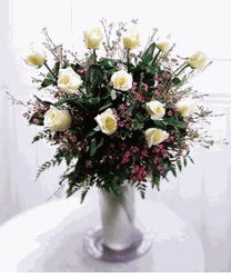Dozen rose bouquet in a glass vase