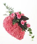 Heart shaped tribute of pink carnations and roses.