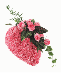 Heart shaped tribute of pink carnations and roses.