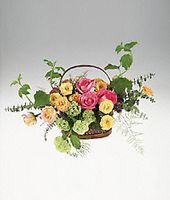 Mixed colorful roses in a basket.