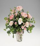Mixed roses in a ginger jar vase.