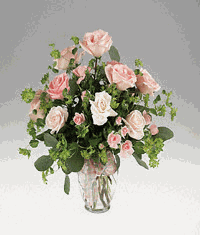 Mixed roses in a ginger jar vase.