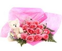Pink rose bouquet and small bear