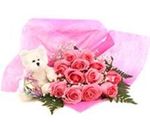 Pink rose bouquet and small bear
