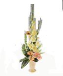 Pottery vase of yellow and peach flowers.