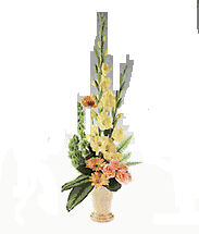 Pottery vase of yellow and peach flowers.