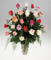 Twenty four mixed roses in a vase.