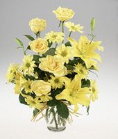 Vase arrangement in all yellow flowers.