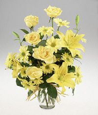 Vase arrangement in all yellow flowers.