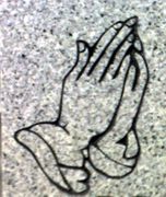 Cemetery Headstone Praying Hands Design on Gray Granite Cemetery Headstone Praying Hands Design on Gray Granite
