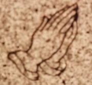 Praying Hands Engraved into a Memorial