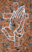 Praying Hands With a Cross on a Monument of Marble Red Granite Praying Hands With a Cross on a Monument of Marble Red Granite