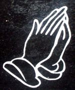 Sandblasted Cemetery Memorial Praying Hands Design on jet black granite Sandblasted Cemetery Memorial Praying Hands Design on jet black granite