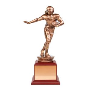13 -1/2 INCH PAINTED ANTIQUE BRONZE FOOTBALL FIGURE TROPHY WITH ROSEWOOD BASE AND COPPER PLATE