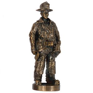 7 INCH FIREMAN FIGURE, ANTIQUE GOLD