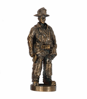7 INCH FIREMAN FIGURE, ANTIQUE GOLD