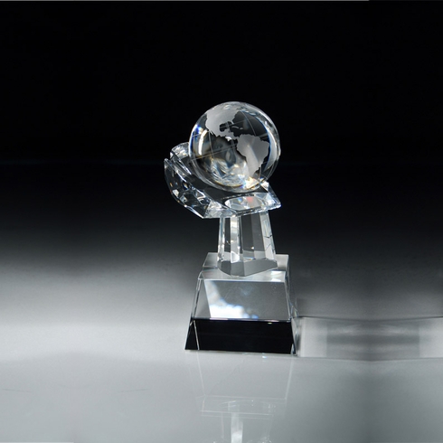 8 1/2"x 3 1/2" CRYSTAL GLOBE IN HAND ON SLANTED BLACK BASE 