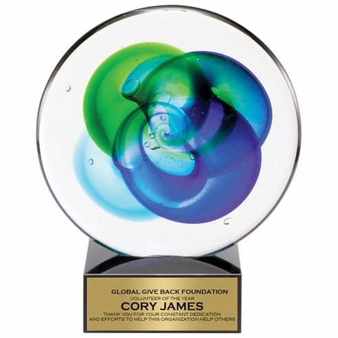 8 INCH ROUND HAND BLOWN BLUE AND GREEN GLASS AWARD WITH SWIRL PATTERN ON A BLACK CRYSTAL BASE