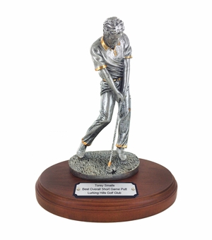 9-1/4 INCH ANTIQUE SILVER MALE GOLFER TROPHY ON OVAL WALNUT BASE