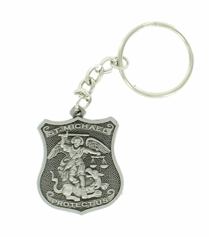 ST. MICHAEL POLICE SHIELD KEY CHAIN ANTIQUE PEWTER FINISH. SIZE 1 5/8 INCH X 1 3/8 INCH.