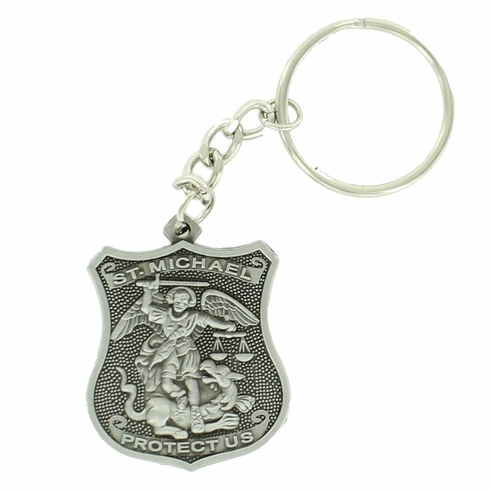 ST. MICHAEL POLICE SHIELD KEY CHAIN ANTIQUE PEWTER FINISH. SIZE 1 5/8 INCH X 1 3/8 INCH.