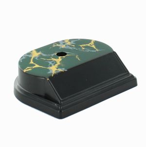 SYNTHETIC MARBLEIZED BLACK AND GOLD TROPHY BASE. 1 HOLE COUNTER SUNK. SIZE 4 1/4 INCH X 3 1/2 INCH X 1 1/8 INCH. HOLDS 3 INCH X 7/8 INCH PLATE.