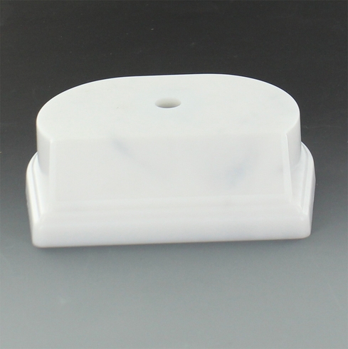 SYNTHETIC MARBLEIZED WHITE TROPHY BASE 4 1/4 INCH X 3 1/2 INCH 1 1/8 INCH. BEVELED EDGE SLANTED FRONT HOLDS 3 INCH X 7/8 INCH PLATE. CENTER HOLE COUNTER SANK.