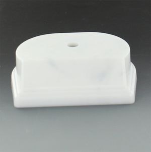 SYNTHETIC MARBLEIZED WHITE TROPHY BASE 4 1/4 INCH X 3 1/2 INCH 1 1/8 INCH. BEVELED EDGE SLANTED FRONT HOLDS 3 INCH X 7/8 INCH PLATE. CENTER HOLE COUNTER SANK.