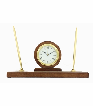 WALNUT FINISH PEN SET WITH QUARTZ BRASS CLOCK WITH BLACK ENGRAVING PLATE. 11 INCH LENGTH X 3 INCH WIDTH X 5 1/2 HEIGHT.