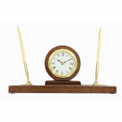 WALNUT FINISH PEN SET WITH QUARTZ BRASS CLOCK WITH BLACK ENGRAVING PLATE. 11 INCH LENGTH X 3 INCH WIDTH X 5 1/2 HEIGHT.